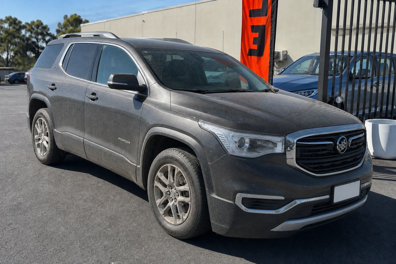 Grey SUV on the NOVO Budget lot in Pinkenba, dull and dusty before detailing